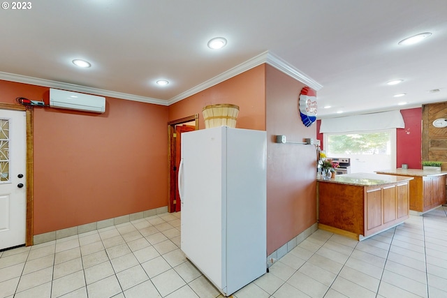 kitchen with white fridge, light tile flooring, a wall unit AC, ornamental molding, and light stone counters