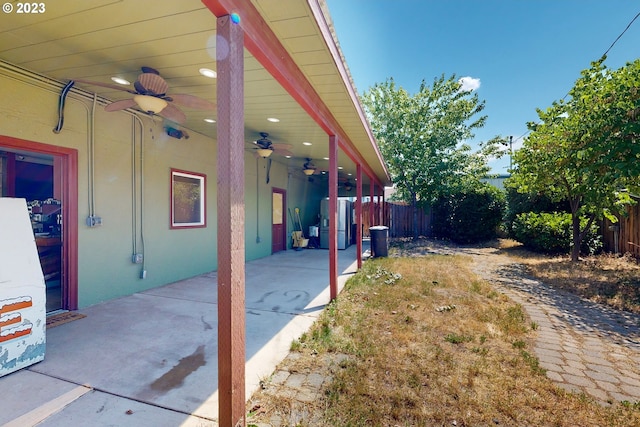 view of patio featuring ceiling fan