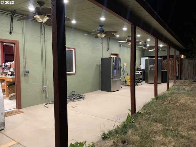 view of patio featuring ceiling fan