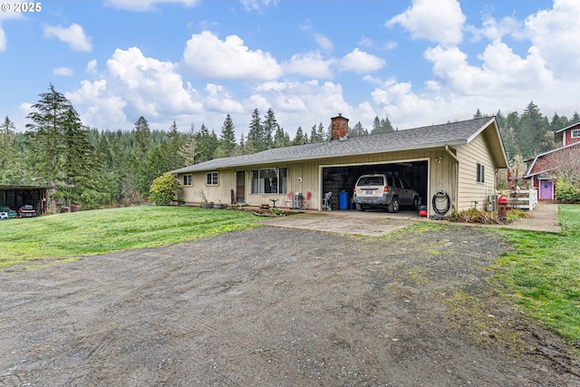 single story home featuring a front yard and a garage