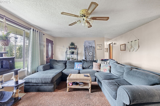 carpeted living room featuring a textured ceiling and ceiling fan