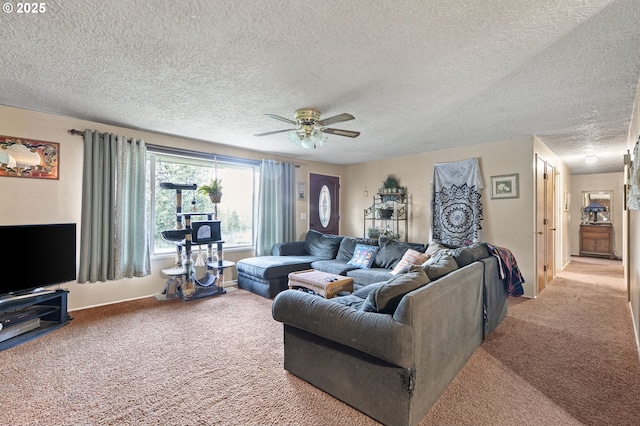 carpeted living room featuring a textured ceiling and ceiling fan