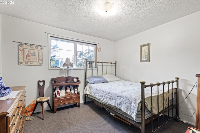 carpeted bedroom with a textured ceiling