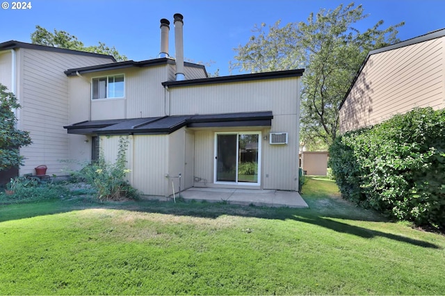 back of house featuring an AC wall unit and a yard