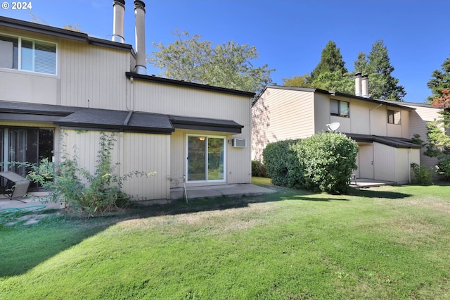 rear view of property with a patio area and a yard