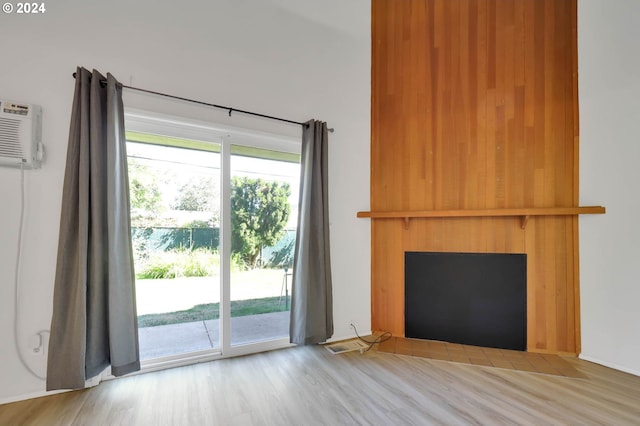 unfurnished living room featuring a fireplace and light wood-type flooring