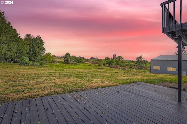 deck at dusk with a lawn