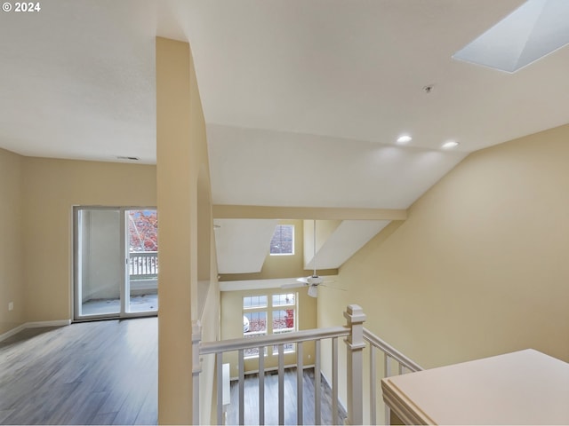 6357 NE Brighton St, Hillsboro, OR 97124 - staircase featuring wood finished floors, a skylight, baseboards, recessed lighting, and lofted ceiling
