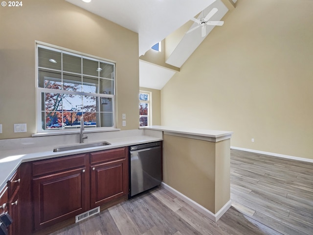 6357 NE Brighton St, Hillsboro, OR 97124 - kitchen featuring dishwasher, a sink, a peninsula, light wood finished floors, and ceiling fan
