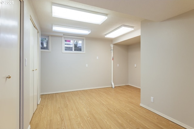 basement featuring light hardwood / wood-style flooring