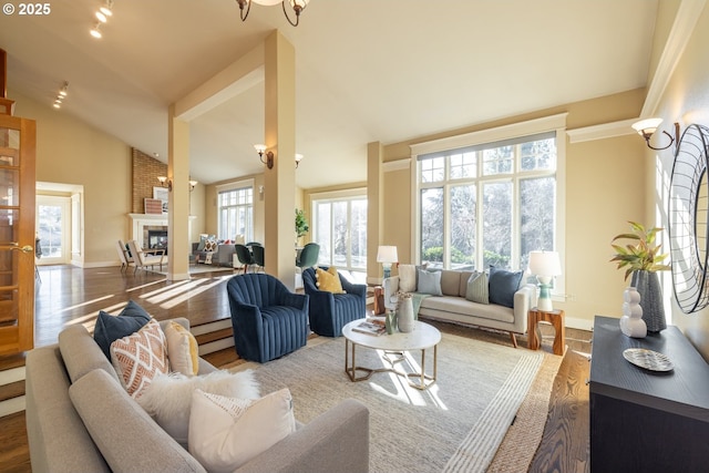 living room with hardwood / wood-style floors and vaulted ceiling