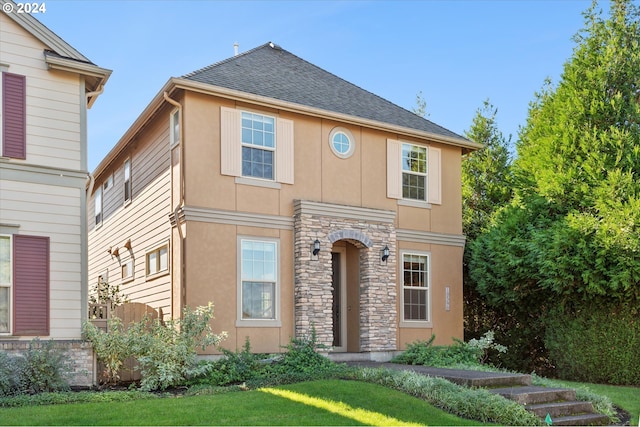 view of front property featuring a front lawn