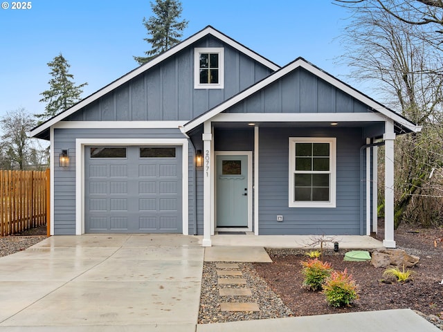 view of front of property featuring a porch and a garage