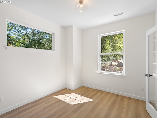 spare room with light wood-type flooring