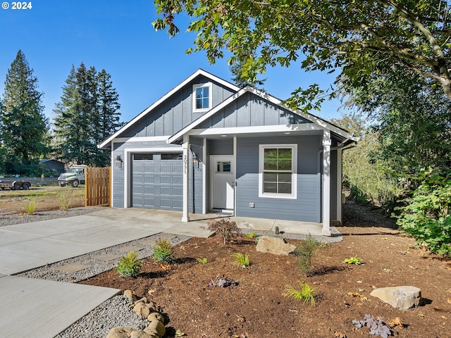 view of front of property with a garage and covered porch