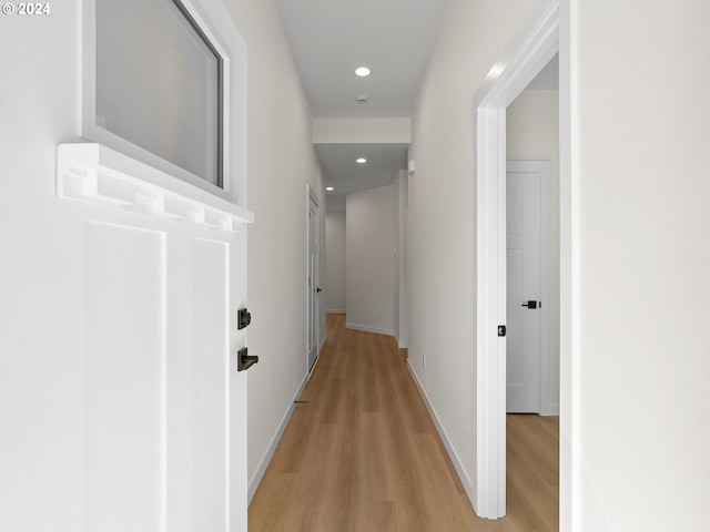 hall with light hardwood / wood-style floors