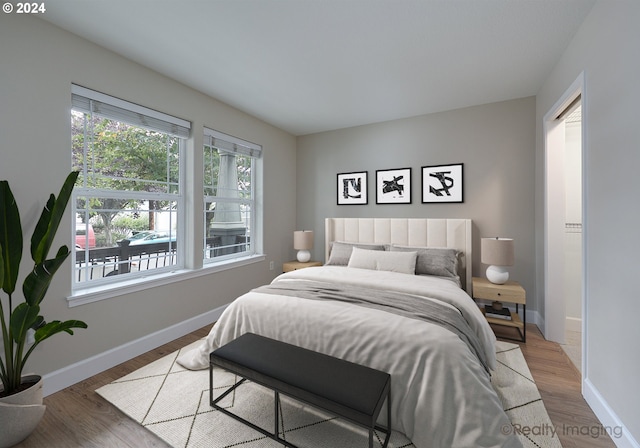 bedroom with hardwood / wood-style flooring