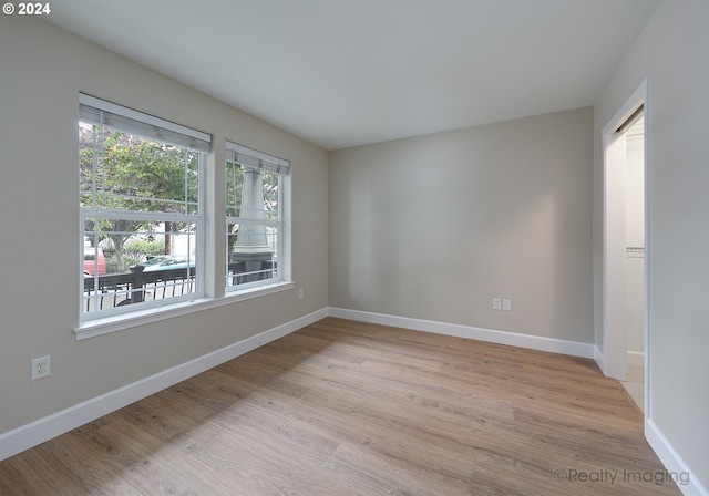 unfurnished room featuring light wood-type flooring