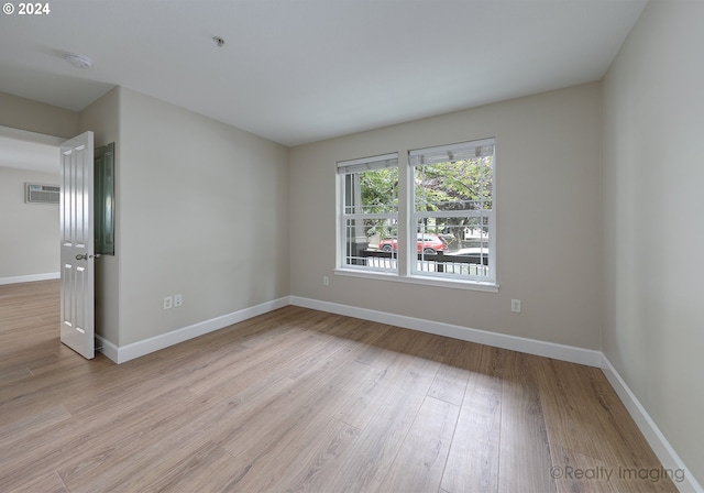 spare room with light hardwood / wood-style flooring