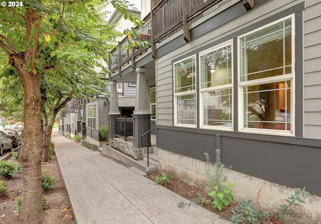 view of property exterior featuring a balcony