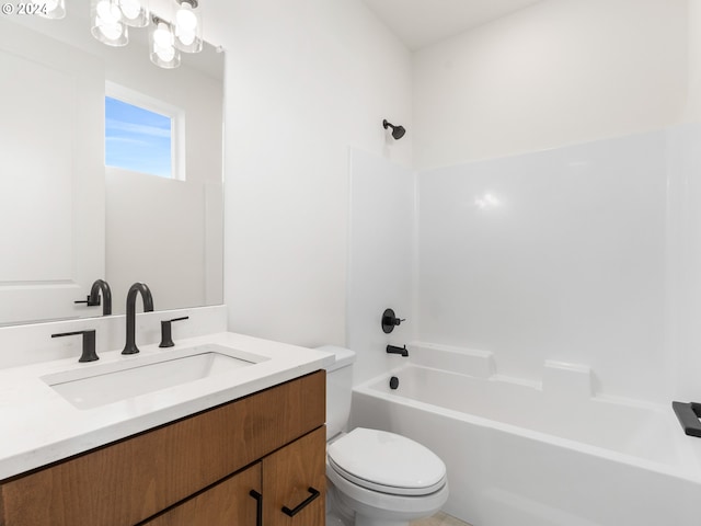 full bathroom with vanity, bathing tub / shower combination, and toilet