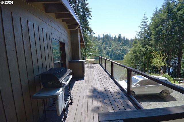 wooden terrace with area for grilling