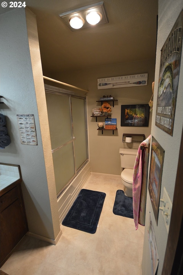 full bathroom with vanity, toilet, and enclosed tub / shower combo