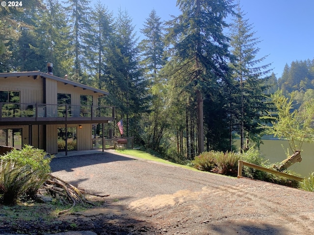 view of yard featuring a patio area and a wooden deck