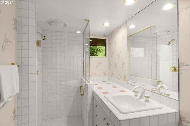 bathroom featuring vanity and an enclosed shower