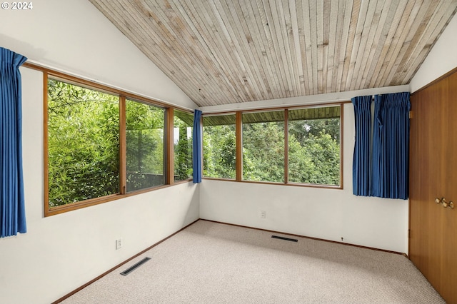 unfurnished sunroom featuring lofted ceiling, wood ceiling, and visible vents