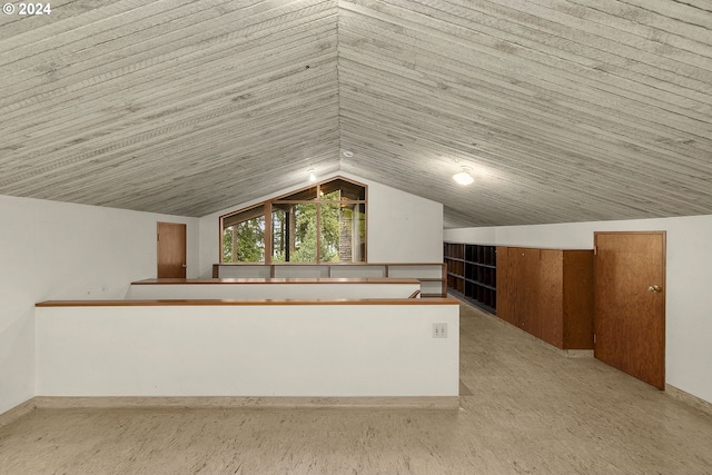 additional living space featuring lofted ceiling