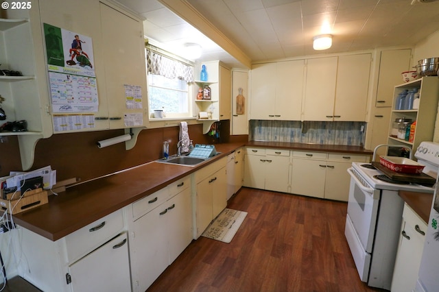 kitchen with white cabinetry, sink, dark wood-type flooring, and white appliances