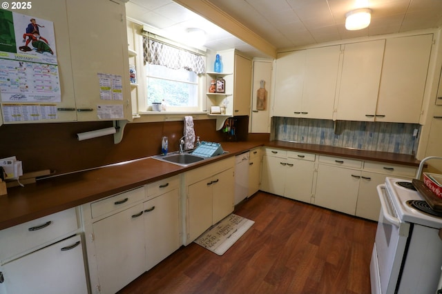 kitchen with dark hardwood / wood-style floors, white appliances, white cabinetry, and sink