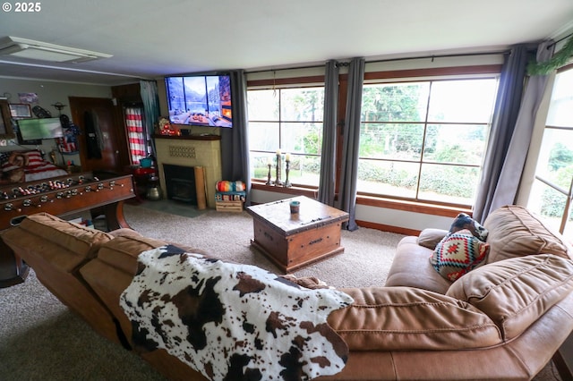 carpeted living room featuring a fireplace