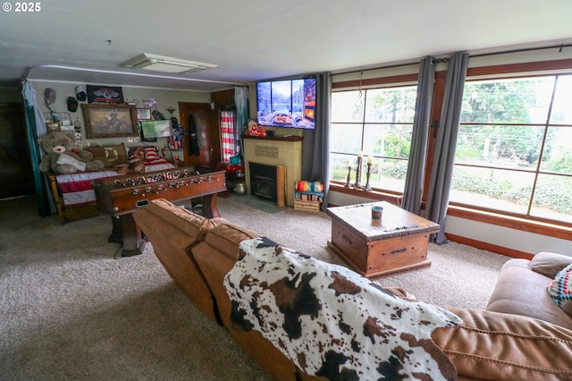 carpeted living room featuring plenty of natural light