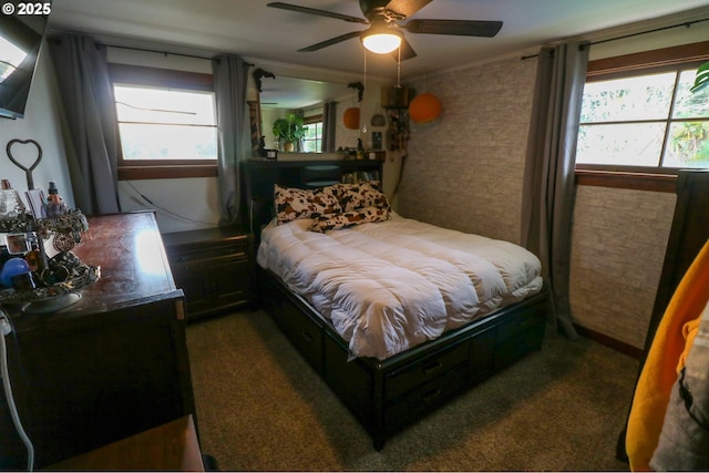 carpeted bedroom featuring multiple windows, ceiling fan, and crown molding