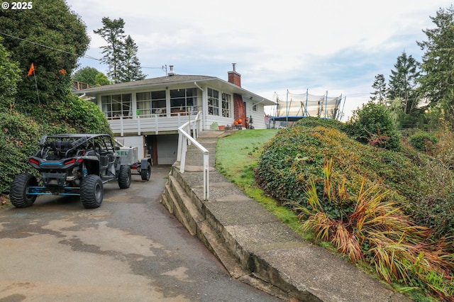 view of front facade with a sunroom and a garage