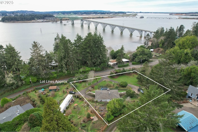 birds eye view of property with a water view