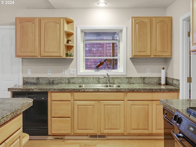 kitchen with light hardwood / wood-style flooring, black dishwasher, light brown cabinets, and sink