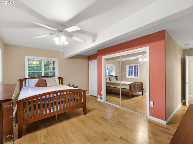 bedroom with light wood-type flooring and ceiling fan