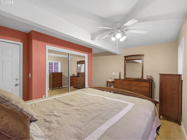 bedroom with ceiling fan and light hardwood / wood-style flooring