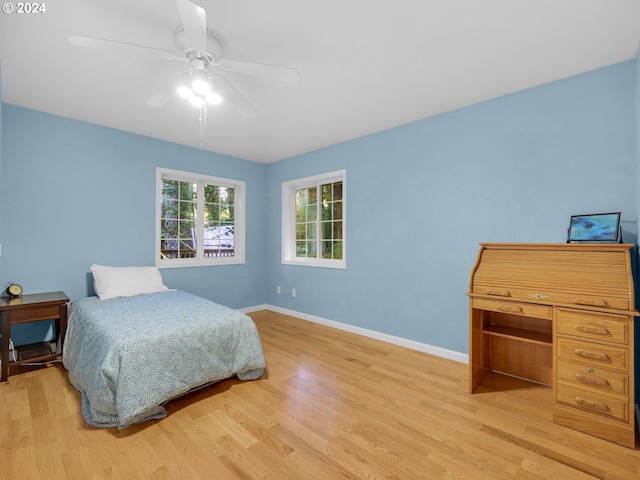 bedroom featuring light hardwood / wood-style flooring and ceiling fan