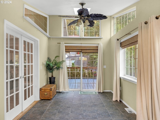 entryway with ceiling fan and french doors