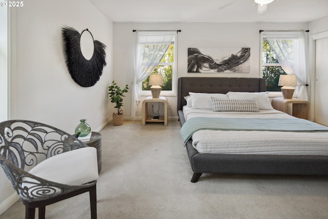 bedroom featuring multiple windows and baseboards