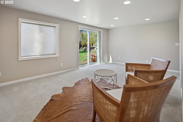 living area with carpet floors, baseboards, and recessed lighting