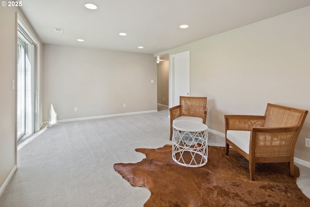 sitting room with recessed lighting, carpet flooring, visible vents, and baseboards