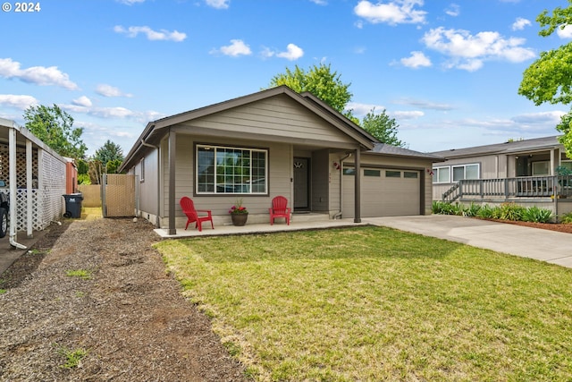 view of front of property with a garage, a porch, and a front lawn