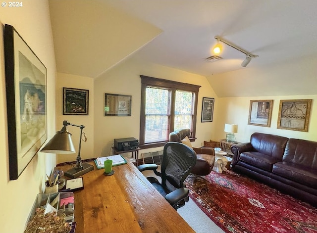 office area with vaulted ceiling and hardwood / wood-style flooring