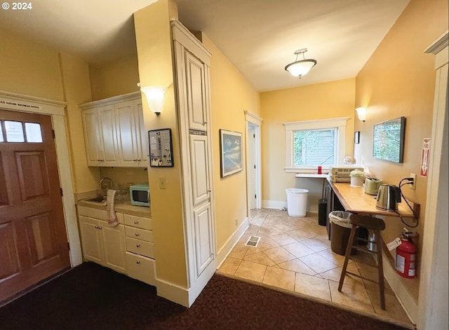 interior space featuring light tile patterned floors