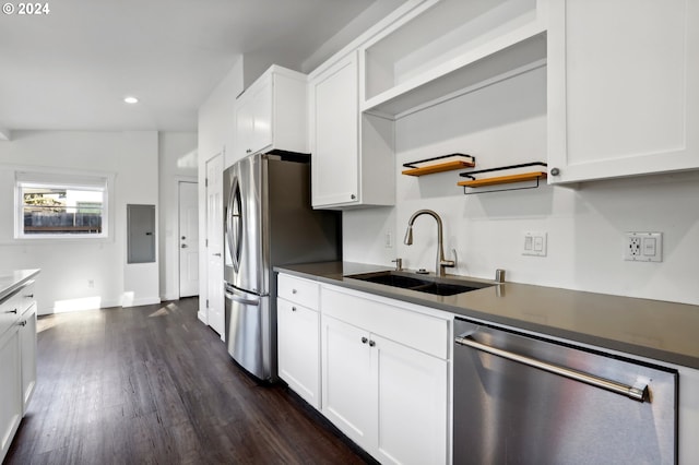 kitchen with stainless steel appliances, white cabinetry, and sink